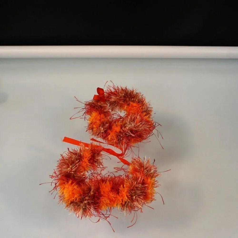 Kupee Wrist Lei Pair Red Orange Eyelash Yarn Tie-Ribbon